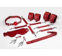 Набор Feral Feelings BDSM Kit 7 Red, наручники, поножи, коннектор, маска, паддл, кляп, зажимы